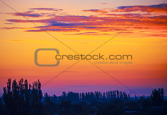 Evening landscape in the red-yellow-blue colors