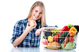 Isolated young woman holding basket of vegetables on light backgraund