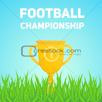Golden trophy cup on field grass.