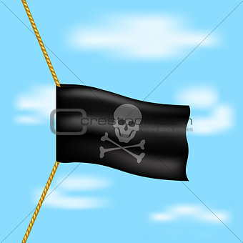 Pirate flag with skull symbol hanging on rope on blue sky