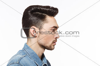 Man with modern hairstyle in studio