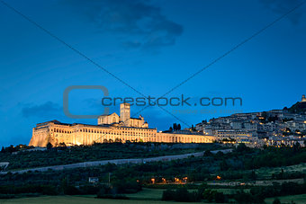 Illuminated cityscape Assisi basilica and monastery 