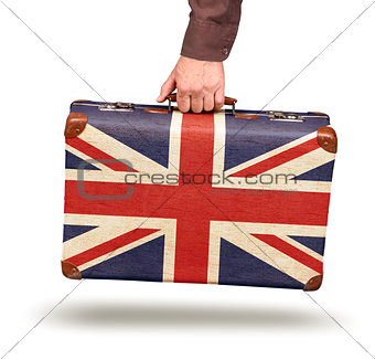 Male hand holding vintage Union Jack suitcase