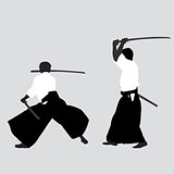 Men silhouettes practicing Aikido