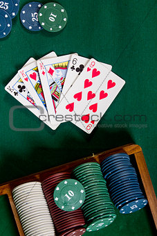 Cards with poker hand with chips