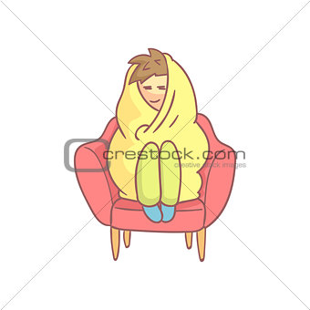 Guy Sitting In The Armchair Wrapped In Blanked