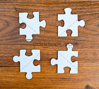 Four blue pieces of puzzle 