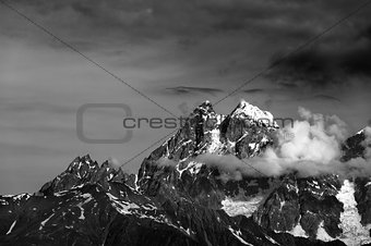 Black and white mountains in clouds
