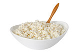 isolated cottage cheese with the wooden spoon in a bowl