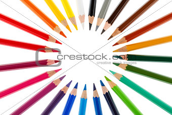 Colored pencils stacked in a circle isolated on white background