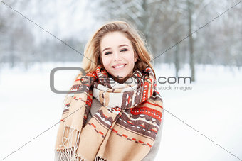 Young beautiful girl with a cute smile in vintage scarf and mitt