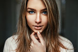 Close-up portrait of a pretty young woman with amazing blue eyes
