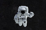 Spaceman travels on a background of stars. Astronaut outer space