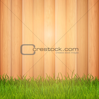 Grass on wooden background 