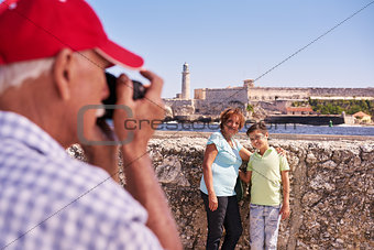 Grandparents With Boy Family Holidays In Cuba Taking Photo