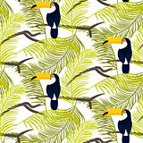 Green palm leaves and toucan bird seamless vector pattern.