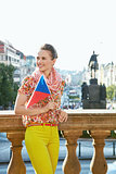 Happy woman with Czech flag standing at Wenceslas Square, Prague