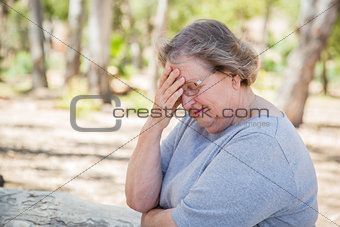 Upset Senior Woman Sitting Alone