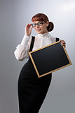 Woman with small blackboard