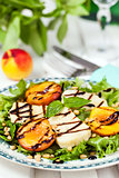 Salad with grilled halloumi cheese and peaches