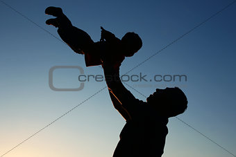 silhouette of father and son 