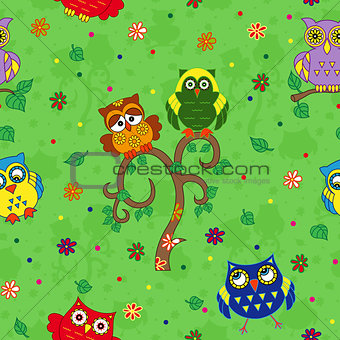 Funny colourful owl seamless pattern over green