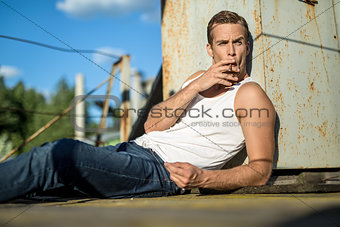 Brutal guy with cigarette