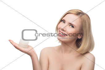 Beautiful middle aged woman with cream