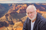 Happy Senior Man Posing on Edge of The Grand Canyon