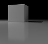 Gray cube with shadow on black background