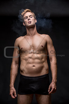 Smoking guy in underpants
