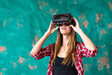 Woman in virtual reality headset enjoying her experience