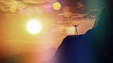 3D female on top of a cliff against a sunset sky