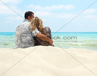 couple in love on the shore of the sea