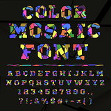 Broken colored alphabet on a dark background