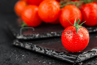 Cherry tomatoes on slate backgound