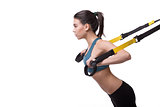 Woman training with suspension trainer sling