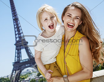 mother and daughter tourists having fun time in Paris, France