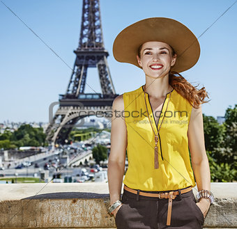 smiling young woman in bright blouse in Paris, France