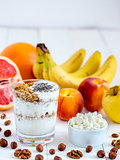 cottage cheese, yogurt, fruits and nuts vertical