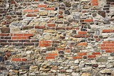 Old wall from stones and bricks