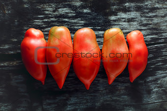 Tomatoes on a wooden surface