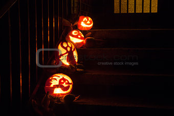 Halloween pumpkins on door steps