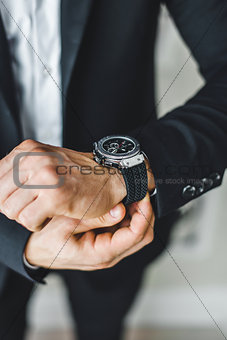 businessman looking at his watch.