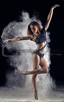 Artistic dance pose using powder or dust