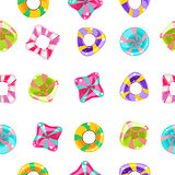 Seamless background with colorful candies on a white background.