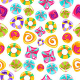 Seamless background with colorful candies on a white background.