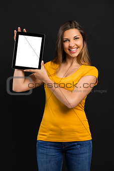 Woman holding and showing a tablet