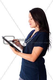 Nurse writing digital patient chart