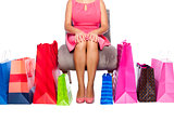Woman sitting with Shopping bags